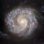 Hubble’s Hypnotic Spiral Galaxy Unwinds a 90-Million-Year Mystery