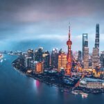 CHINA’S ECONOMY GAINS MOMENTUM AS EXPORTS RISE, BUT PROPERTY CRISIS DEEPENS